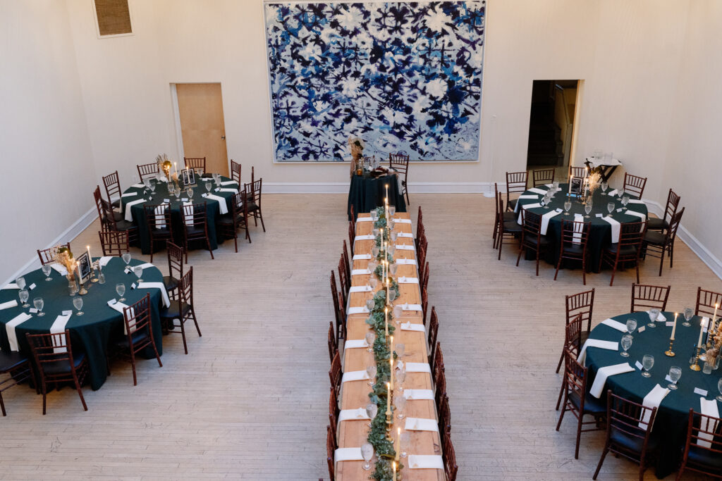 top down photo of a small intimate wedding reception table setup with one long table down the center of the space