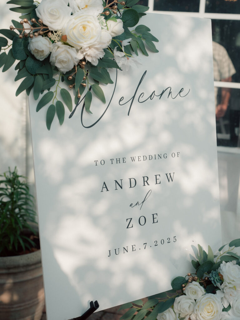 Floral welcome sign for wedding of Andrew and Zoe on June 7, 2025 at The Marquee at New Town