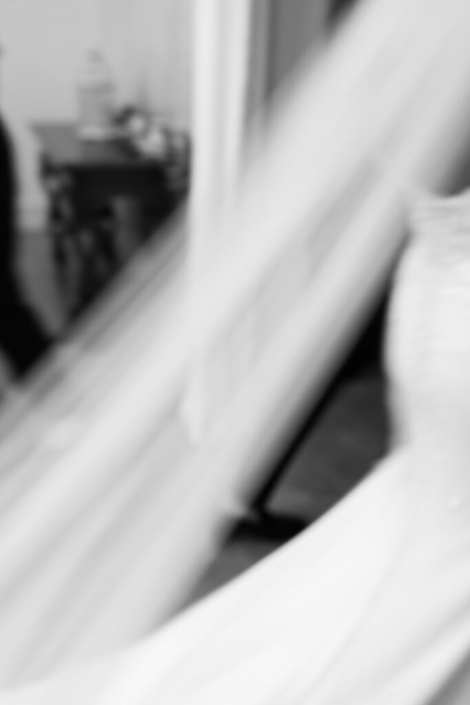 Artistic motion blur of bride’s veil during wedding recessional at The Marquee at New Town